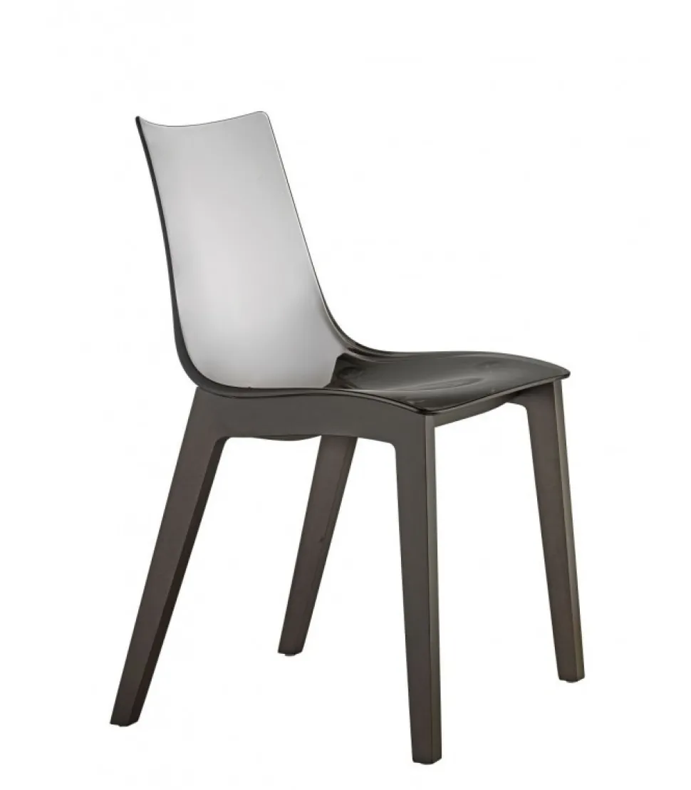 La Scocca In Policarbonato E Disponibile Bianca E Trasparente, Le Gambe In Faggio Naturale E Wenge.